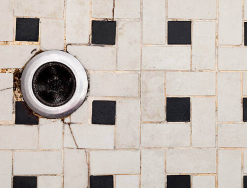 How do you remove soap scum from shower tiles?